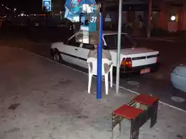 A taxi driver waiting for a stupid, drunk turist to arrive