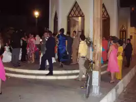 A wedding is about to start in the church behind