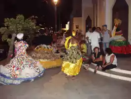 Some African dance show beginning in front of a Catholic church