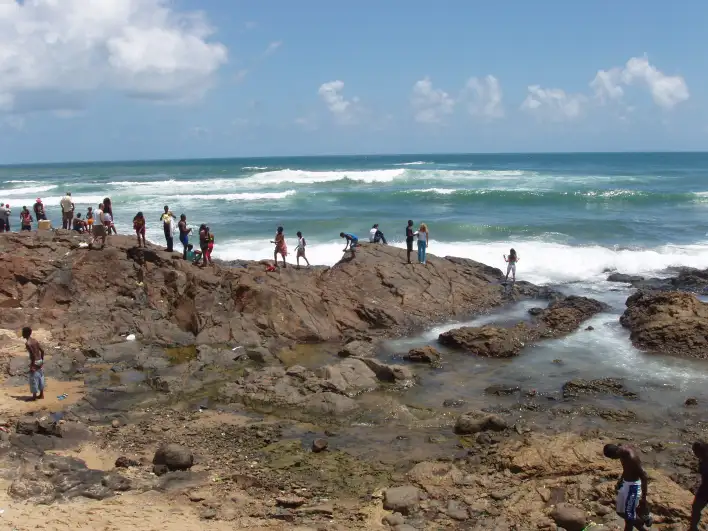 Throwing flowers into the sea for some CandomblÃ© God called Iemanja