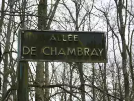 A sign in the middle of a forest. Theres no wilderness in France