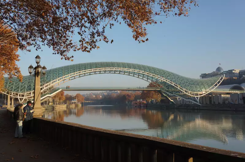 Futuristic bridge in a run-down city