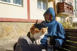 Sitting with a stray cat
