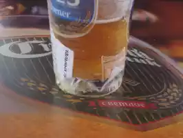 A beer glass with trash