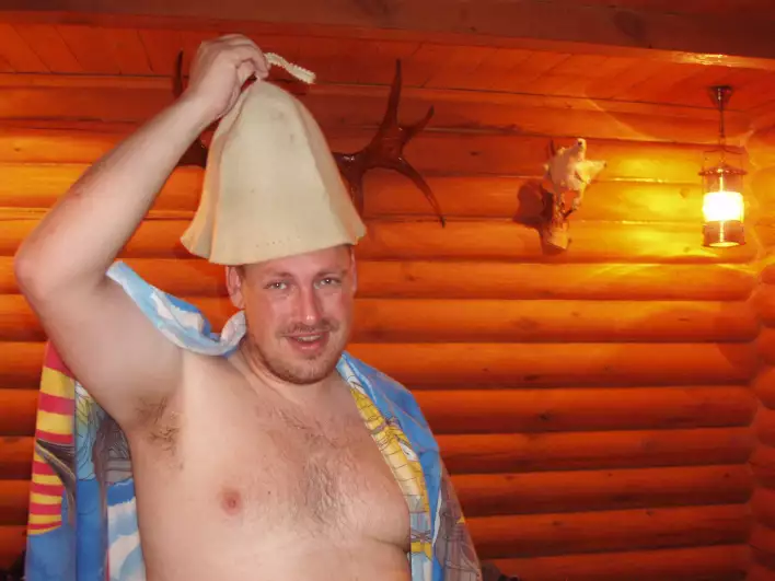 In the sauna with the hat to protect the brain (what brain?)