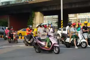 Scooter drivers use masks to protect themselves from the air pollution caused by their scooters. How about just walking