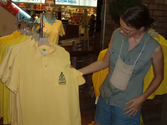 Päivi checking the yellow t-shirts, but theyre too small for Santeri