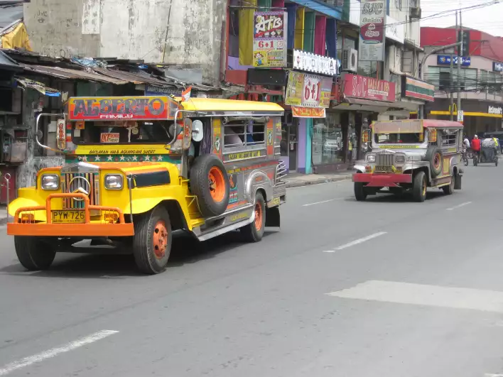 Two jeepneys in Manila traffic