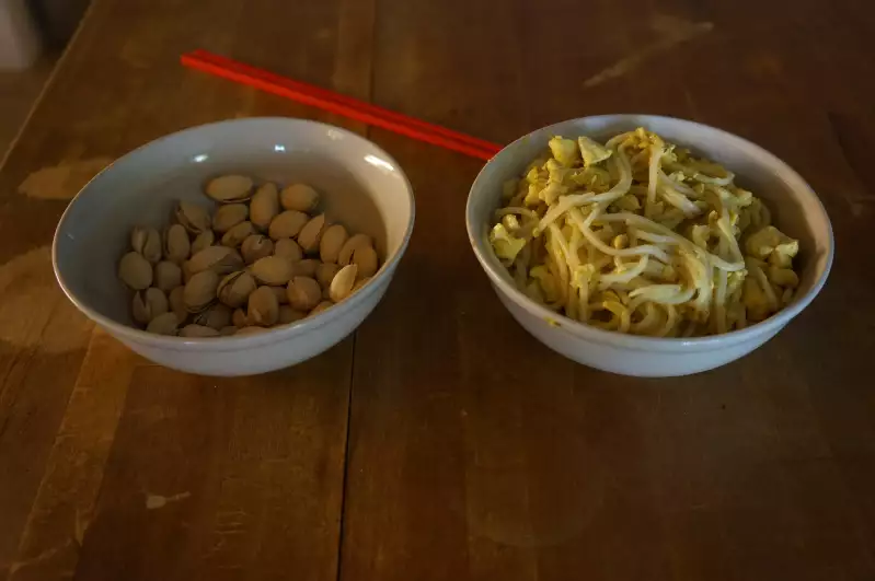 Curry-tofu-noodles with pistachios, and later pineapple for dessert